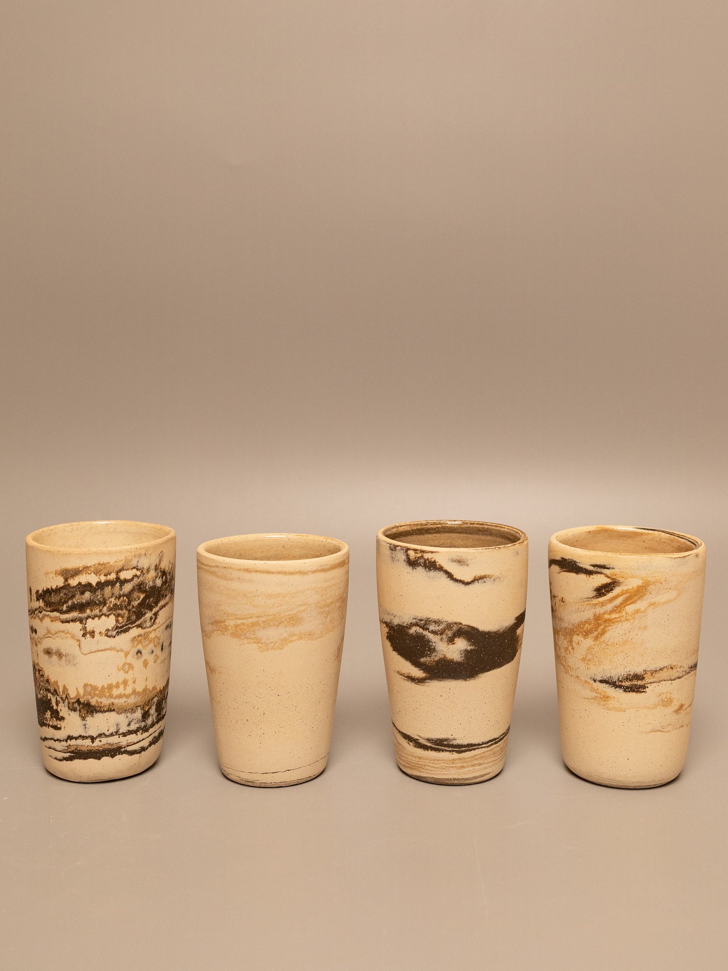 Tall marbled clay cup 1